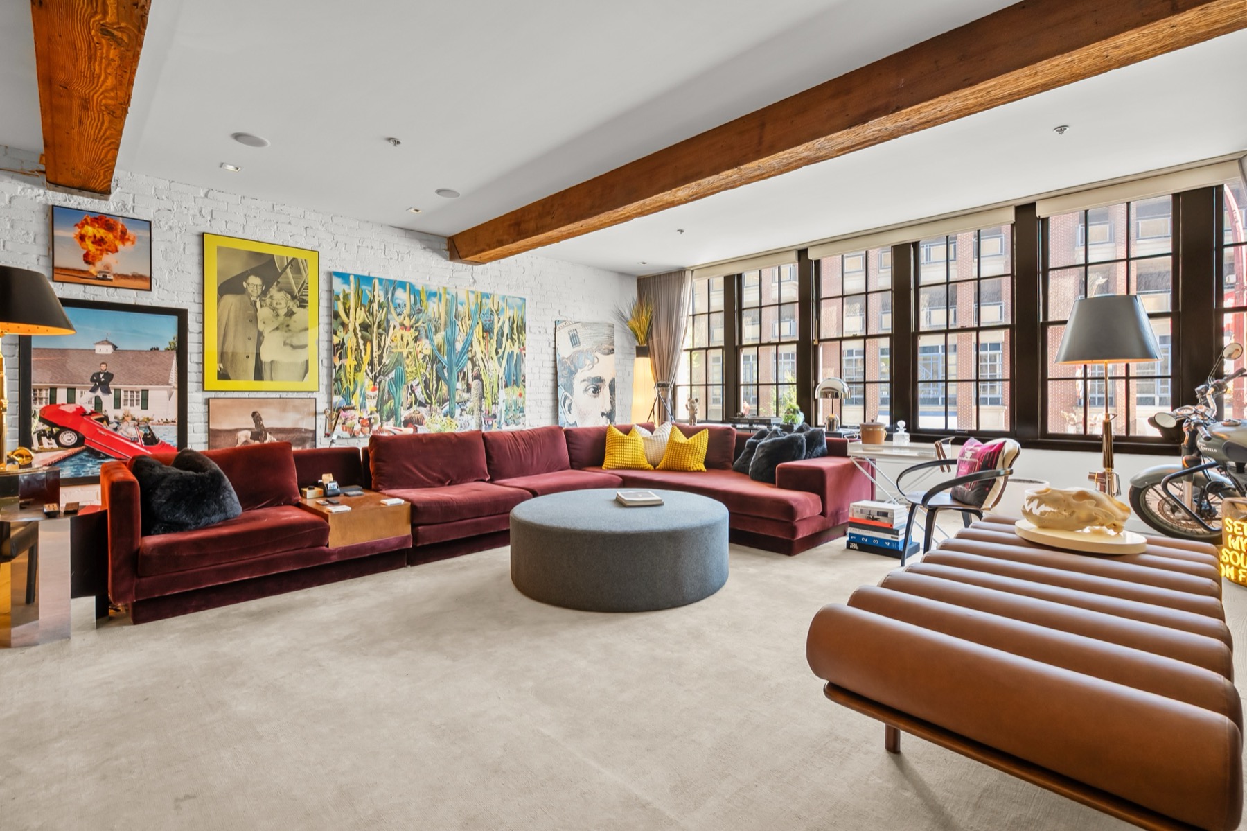 Wide lounge in The Keefer World Cup Suite with designer furnishings and art